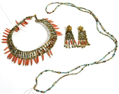 Lot 201 - An Egyptian revival coral and ceramic bead collet necklace and clip earring suite, the stiff collet