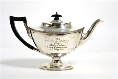 Lot 213 - A silver teapot marked for London with presentation inscription