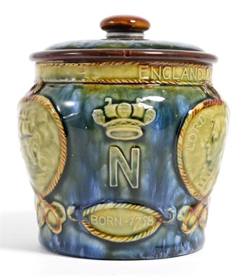 Lot 214 - A Royal Doulton stoneware tobacco jar decorated with Lord Nelson