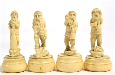 Lot 223 - Four 19th century Continental carved ivory figures of gnomes