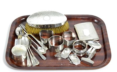 Lot 234 - A quantity of silver including a cigarette case; napkin rings; spirit labels; teaspoons; silver...