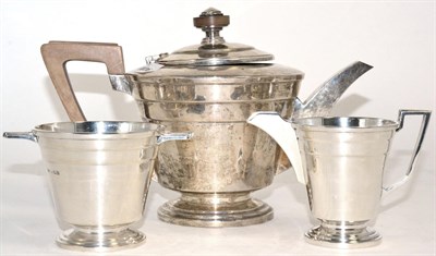 Lot 245 - An Art Deco silver three piece tea set by Walker & Hall