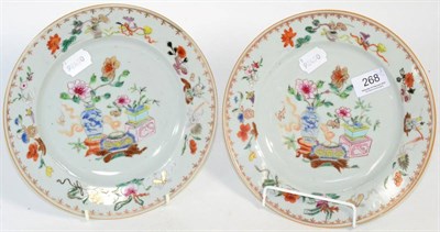 Lot 268 - A pair of 18th century Chinese export plates, painted with flowers and precious objects