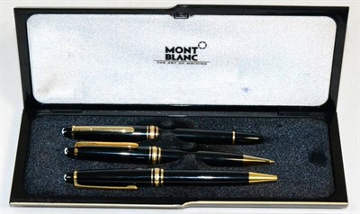 Lot 276 - A cased Mont Blanc fountain pen the nib stamped 14K with matching pencil (cased) together with...