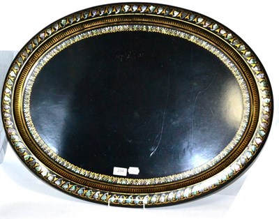 Lot 294 - A Victorian papier mache oval tray with mother of pearl border