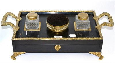 Lot 296 - A Regency ebonised and brass standish