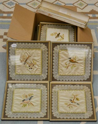 Lot 1054 - A set of ten framed silk work panels and a lace and mother of pearl fan