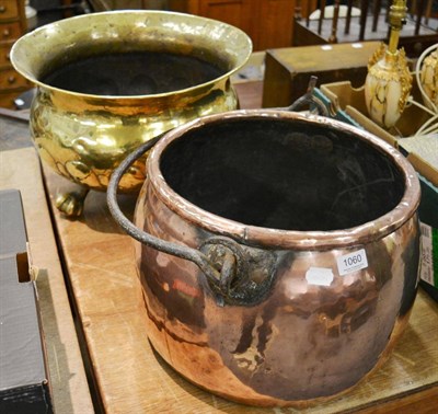 Lot 1060 - A large brass jardiniere and a copper cauldron