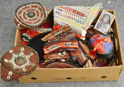 Lot 1073 - A box of assorted Tibetan and Arabian headdresses in turquoise and coral