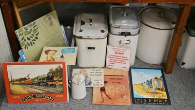 Lot 1075 - A group of enamelled flour and bread bins, two wash boards, reproduction tin signs etc