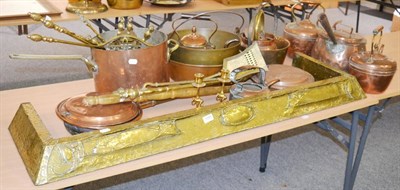 Lot 1090 - A large quantity of brass and copper including a fire curb, bed warmer, jam pans etc