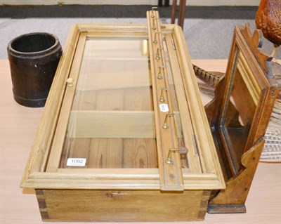 Lot 1092 - A small pine glazed cabinet, an oak mirror, a coat hook and an oak scoop (4)