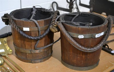 Lot 1098 - Two coopered oak peat buckets with rope and leather handles (2)