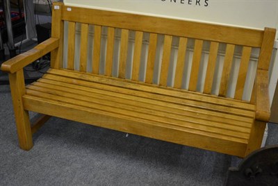 Lot 1127 - A well made oak slatted garden bench