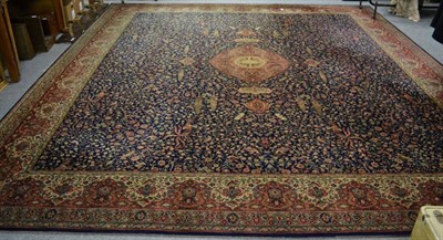 Lot 1134 - A machine made carpet of Oriental design, 408cm by 365cm