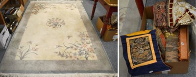 Lot 1136 - Modern carved Chinese carpet, the cream field with floral roundel enclosed by plain borders,...