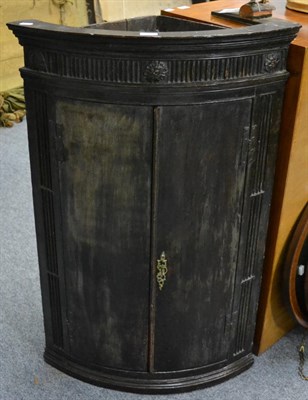 Lot 1140 - Georgian mahogany bow front corner cupboard