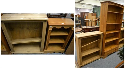 Lot 1143 - Stripped pine comprising a pair of open bookcases; another smaller and a further large example (4)