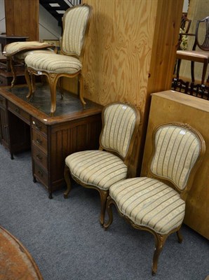 Lot 1147 - A set of four 19th century gilt and gesso dining chairs, recovered in cream floral striped...