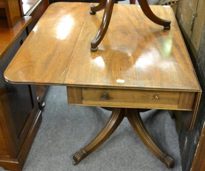 Lot 1154 - A George IV mahogany sofa table, second quarter 19th century, with two rounded drop leaves...