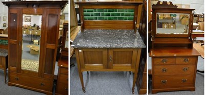 Lot 1158 - An early 20th century mahogany three piece bedroom suite comprising a marble topped and tile backed