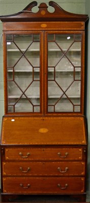 Lot 1171 - An inlaid mahogany astragal glazed bureau bookcase