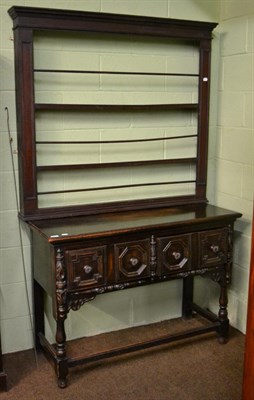 Lot 1187 - A 17th century style dresser base with two geometric moulded drawers and an associated Delft rack