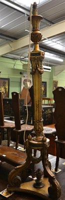 Lot 1193 - Carved gilt wood standard lamp on triform base