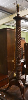 Lot 1195 - Early 20th century carved mahogany standard lamp with spiral turned column