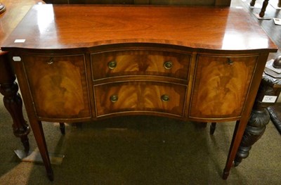 Lot 1197 - Reproduction mahogany serpentine shaped sideboard