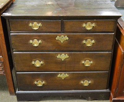 Lot 1219 - The top section of a George III oak chest on chest on associated base