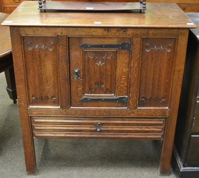 Lot 1221 - A joined oak cupboard, late 19th/early 20th century, carved overall with quatrefoil carving,...