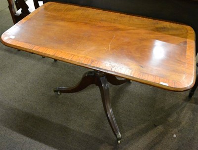 Lot 1229 - A 19th century rectangular tilt top supper table