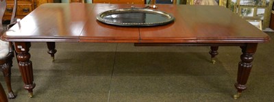 Lot 1230 - A Victorian mahogany wind out dining table with two additional leaves and winder