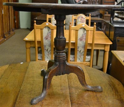 Lot 1258 - An 18th century oak flip top tripod table