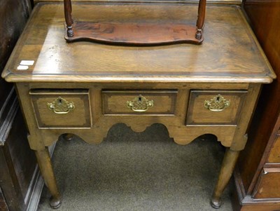 Lot 1262 - A reproduction oak and burr oak lowboy