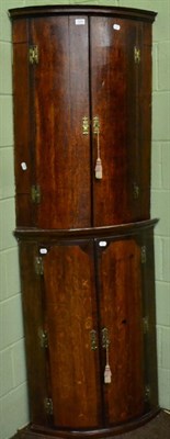 Lot 1293 - Two 18th century oak bow fronted corner cupboards