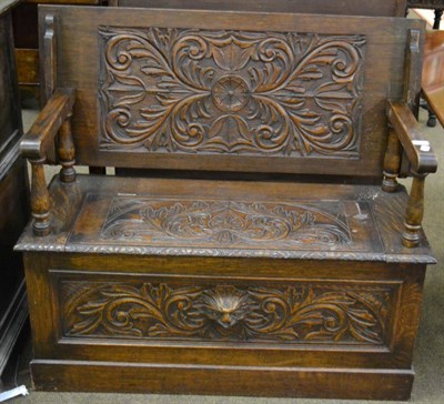 Lot 1299 - An oak monks bench