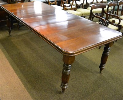 Lot 1301 - A Victorian mahogany extending dining table with two additional leaves