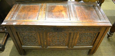 Lot 1302 - An 18th century carved oak coffer