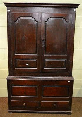 Lot 1306 - An 18th century panelled oak linen press converted to a wardrobe