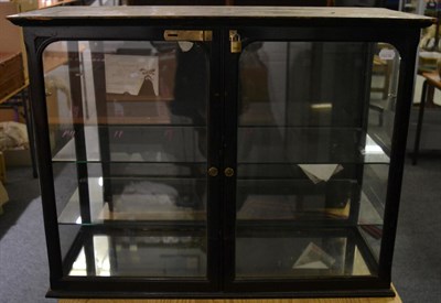 Lot 1336 - Late 19th century ebonised table top shop display cabinet, with four glazed sizes, two glass...