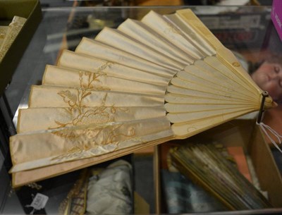 Lot 1359 - Circa 1860s bone fan, with pierced and carved guards and gorge, with a double fabric leaf,...