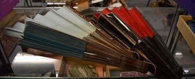 Lot 1361 - Four large wooden late 19th century fans, with either plain paper of fabric leafs, each about 38cm