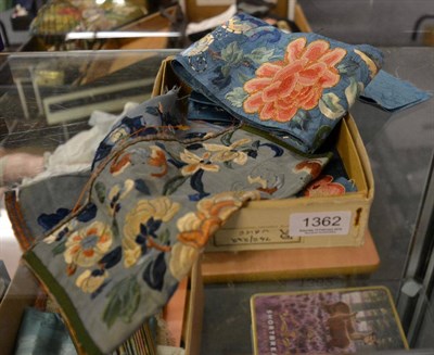 Lot 1362 - Two Chinese blue silk sleeve bands, embroidered similarly with bats and chrysanthemums and a floral