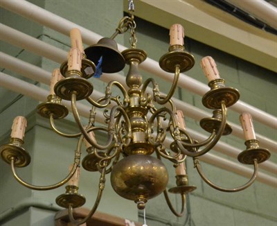 Lot 1370 - A Flemish style twelve light brass chandelier