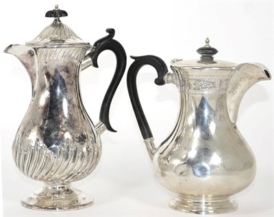 Lot 9 - A silver hot water jug, Walker & Hall, Sheffield 1939, baluster with engraved foliate band; and...