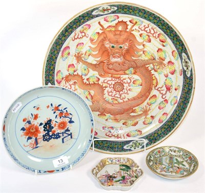Lot 13 - A Chinese Imari saucer dish; a teapot stand; a famille verte saucer; and a dragon charger
