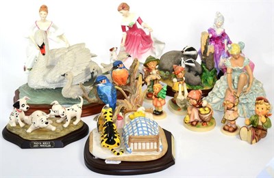 Lot 14 - A group of Royal Doulton; Goebel and other figures; Doulton Winnie the Pooh and 101 Dalmations;...