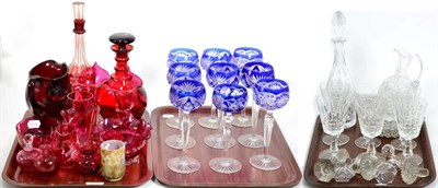 Lot 33 - A quantity of glass including cranberry glass, two decanters, vases, jugs, nine matched blue...